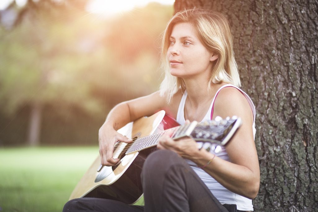 woman playing guitar